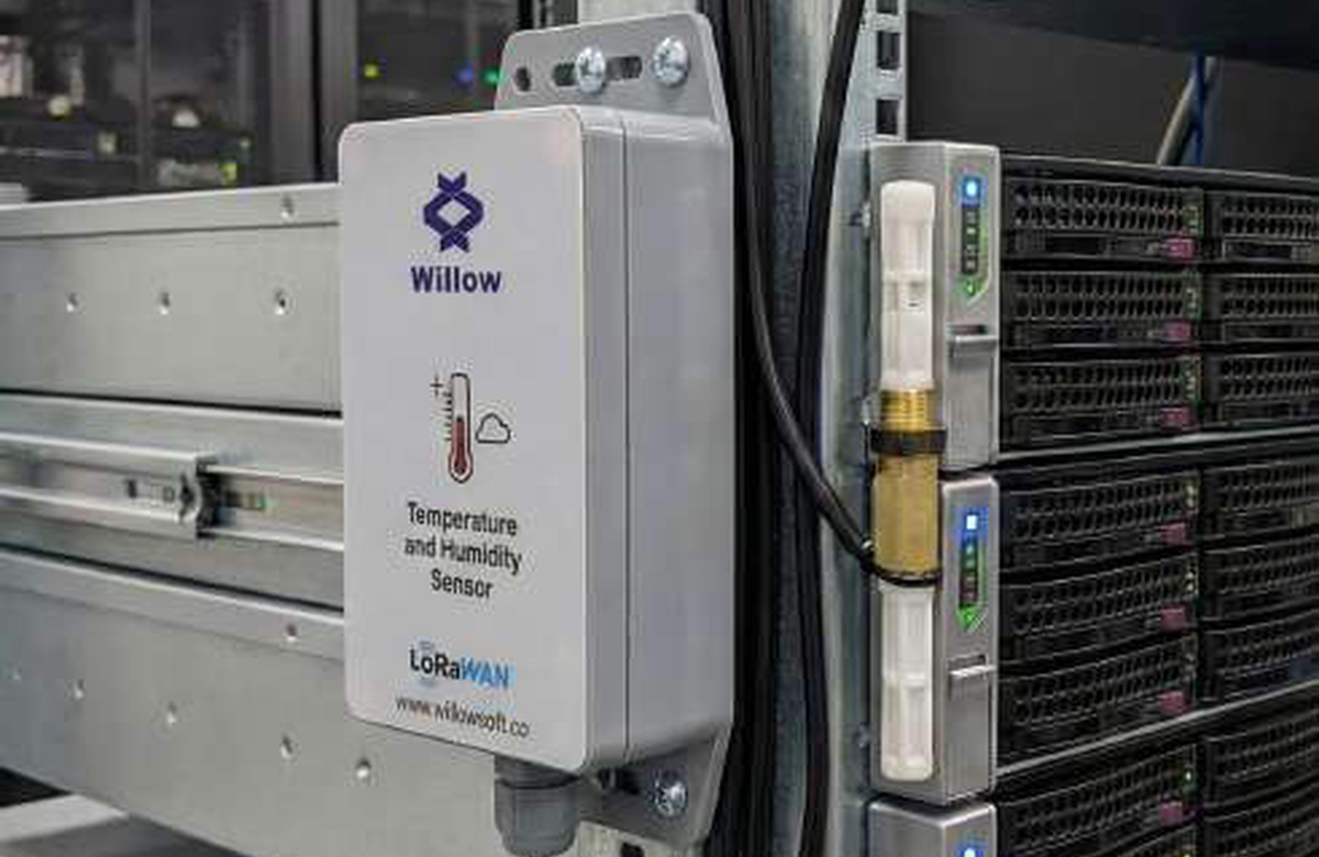 Temperature and humidity sensor installed in a server or industrial environment.